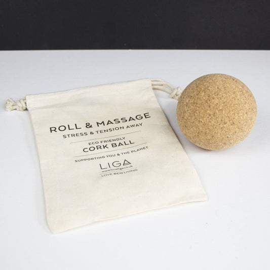 Cork massage ball (same size as a tennis ball) with a drawstring bag saying 'Roll and Massage'