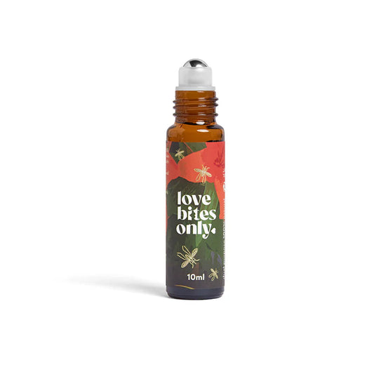 Small bottle labeled 'love bites only' with a metal roller ball applicator on a white background