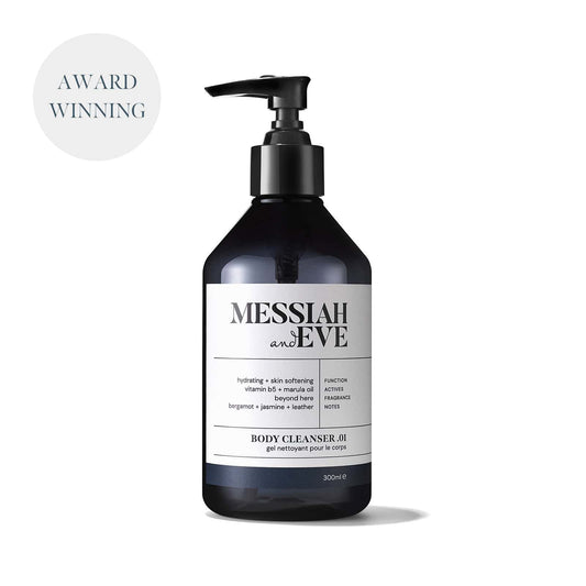 Bottle of shower gel with pump action dispenser and a white label saying 'Messiah and Eve Body Cleanser .01'
