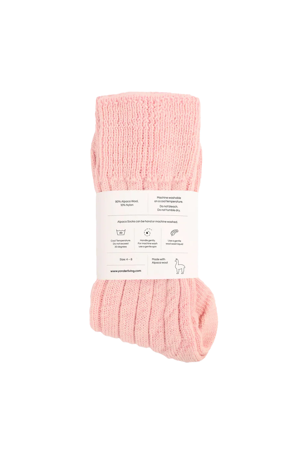 Pink socks with a label on a white background showing care instructions