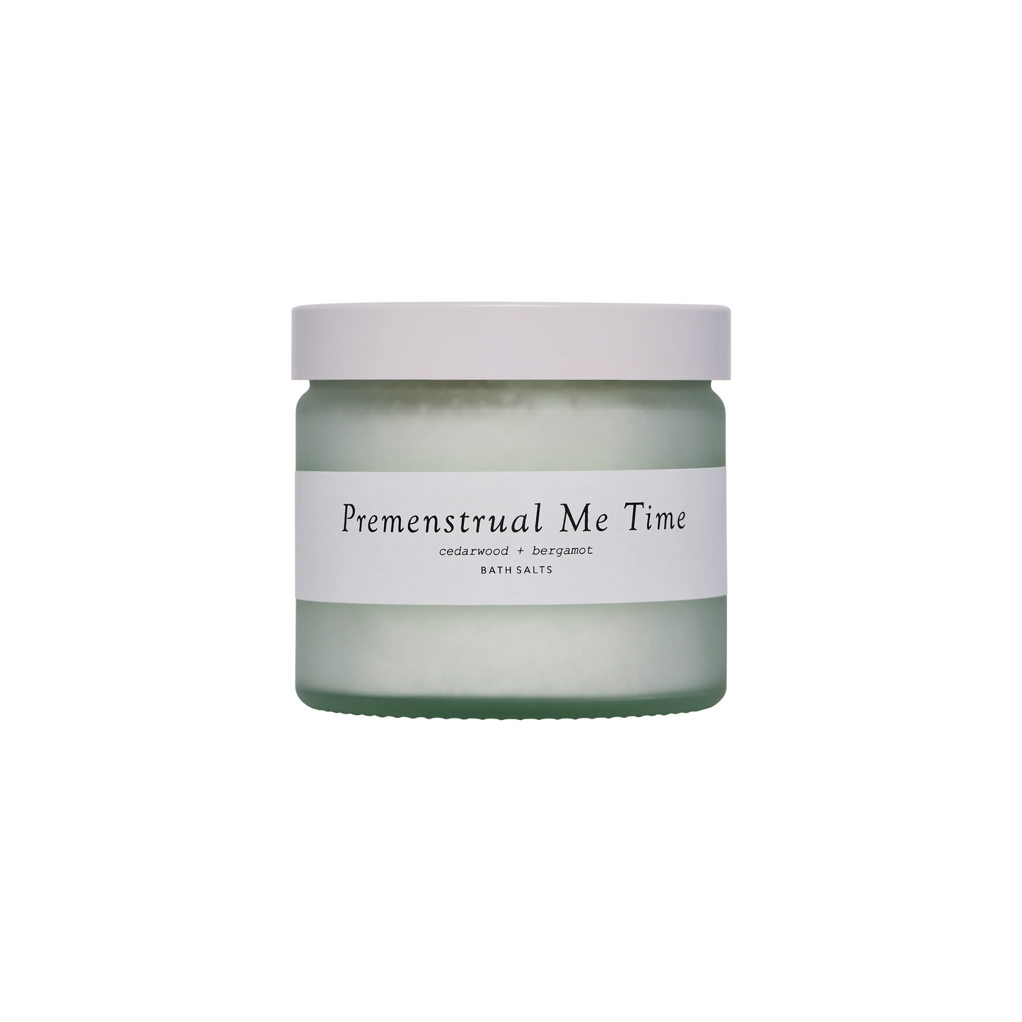 A glass jar with a white lid and a label saying Premenstrual Me Time