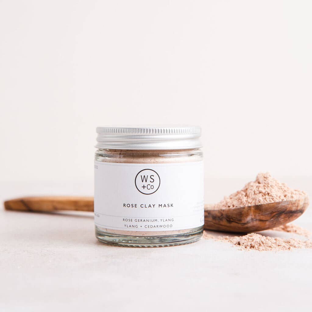 WS+Co rose clay mask jar with wooden spoon on a light background