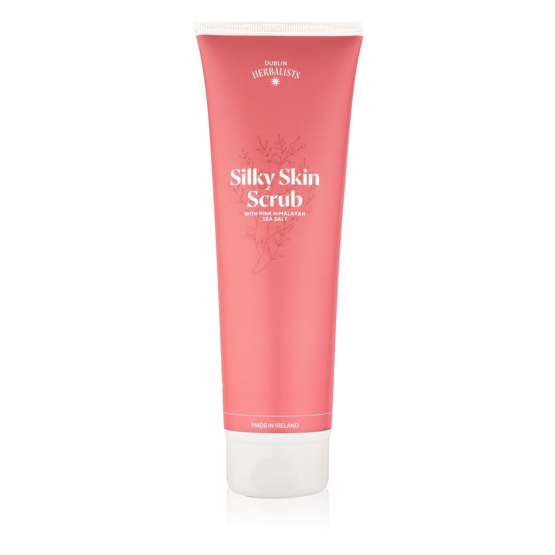 Pink tube of Silky Skin Scrub on a white background
