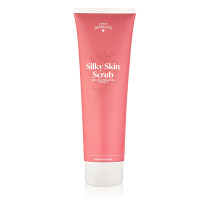 Pink tube of Silky Skin Scrub on a white background