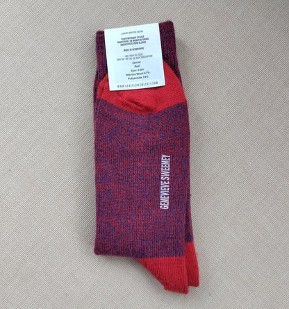 Folded wool socks showing the label with product details and the Genevieve Sweeney branding along the sole of the socks