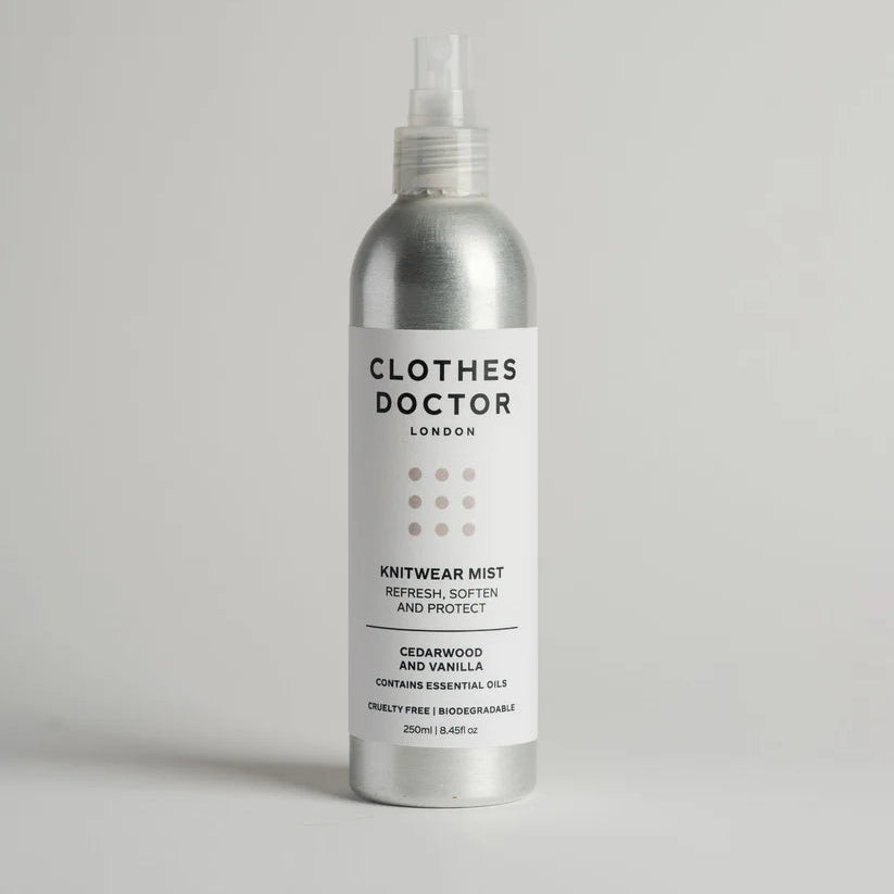 Silver aluminium bottle of Clothes Doctor knitwear mist on a light grey background