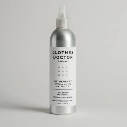 Silver aluminium bottle of Clothes Doctor knitwear mist on a light grey background