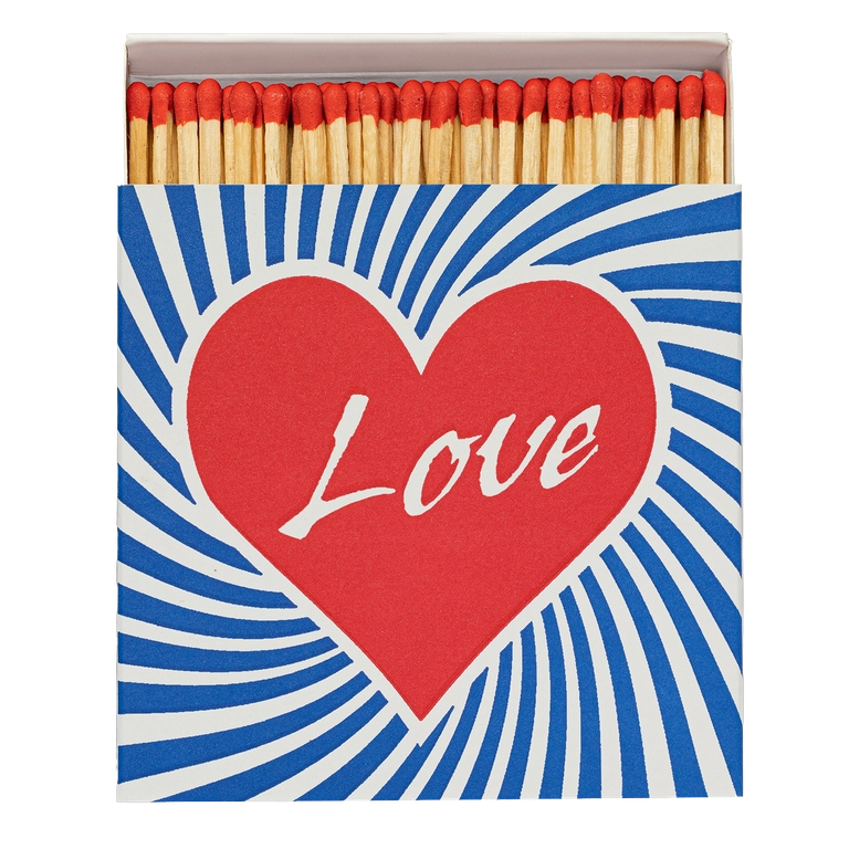 Box of matches open to reveal red-tipped matches in a box with a heart and the word LOVE written in it