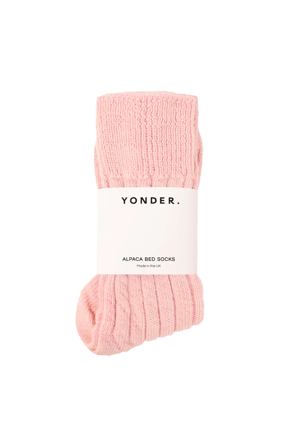Pink alpaca bed socks with a 'Yonder' label on a white background