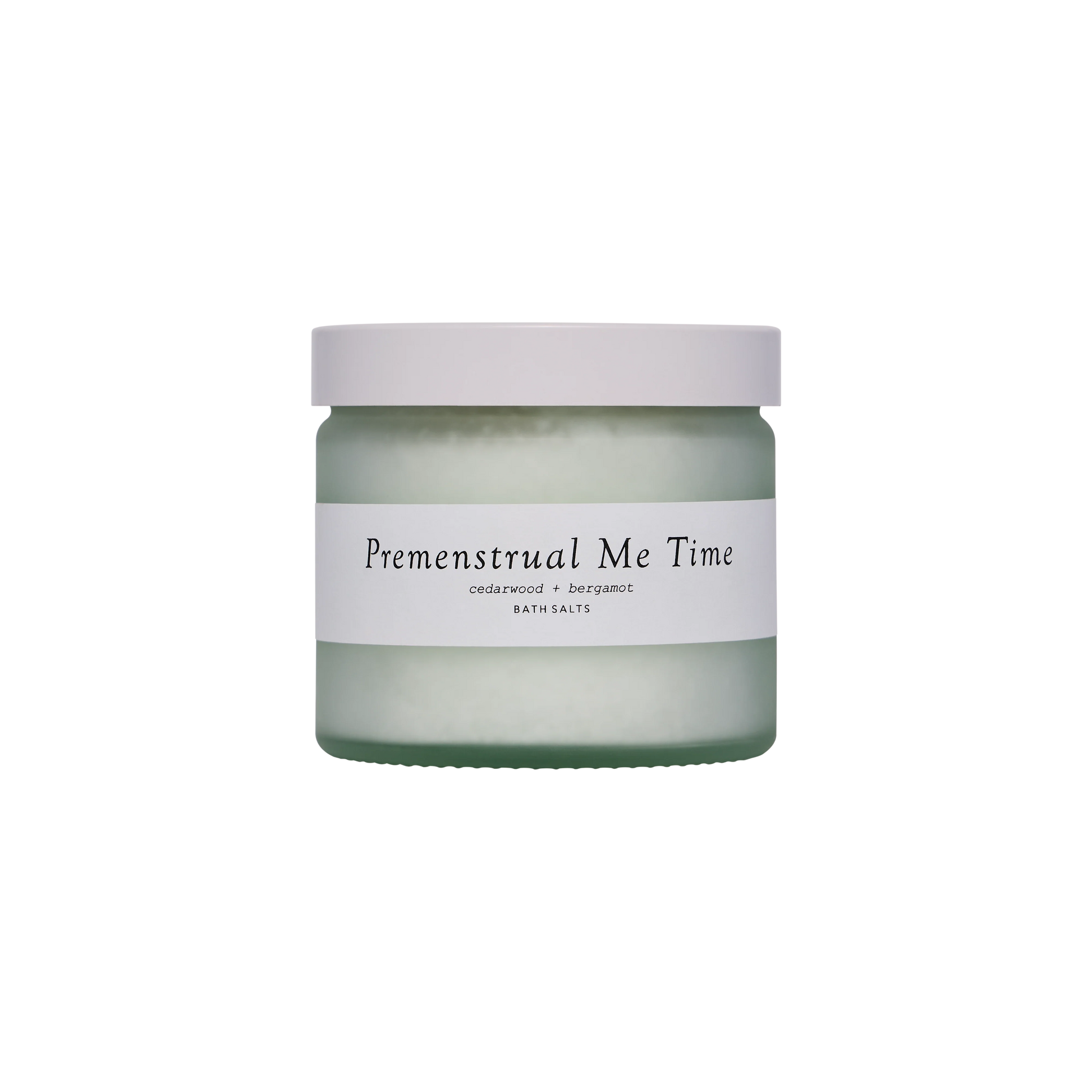 A glass jar with a white lid and a label saying Premenstrual Me Time
