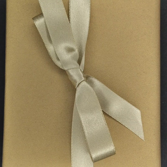 Video footage of someone unwrapping a GOMI power bank and then the footage is reversed and it is re-wrapped.