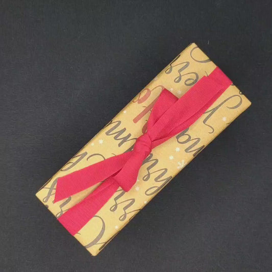 Video of a present being unwrapped to reveal Mrs White's Unstung Hero bottle in a brown box and then the footage put into reverse for it to return to being a wrapped present